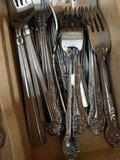 Ornate silverware in a wooden cutlery tray - thumbnail 2 of 2