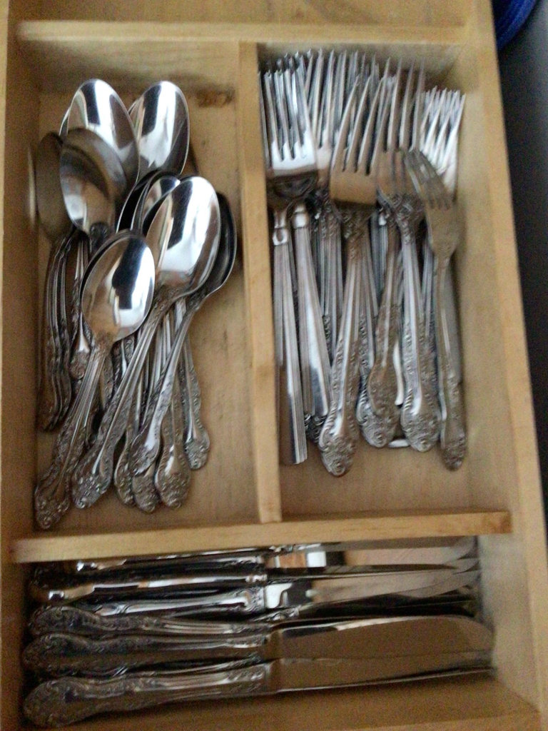 Ornate silverware in a wooden cutlery tray - image 1 of 2