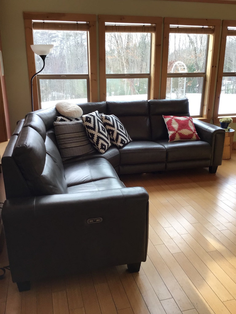 Dark gray leather sectional sofa with power recliners and decorative pillows - image 1 of 6