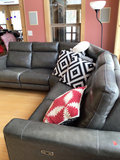Dark gray leather sectional sofa with power recliners and decorative pillows - thumbnail 2 of 6