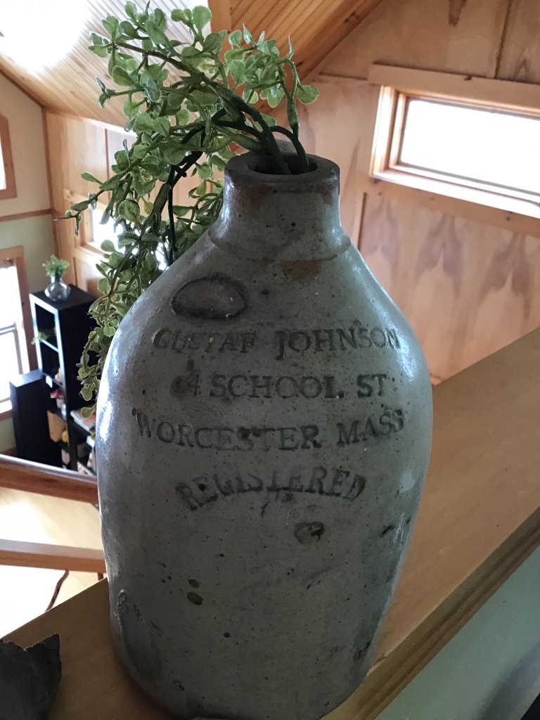 Antique embossed stoneware jug with plant and driftwood - image 2 of 3