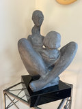 Abstract seated sculpture on metal stand - thumbnail 3 of 5