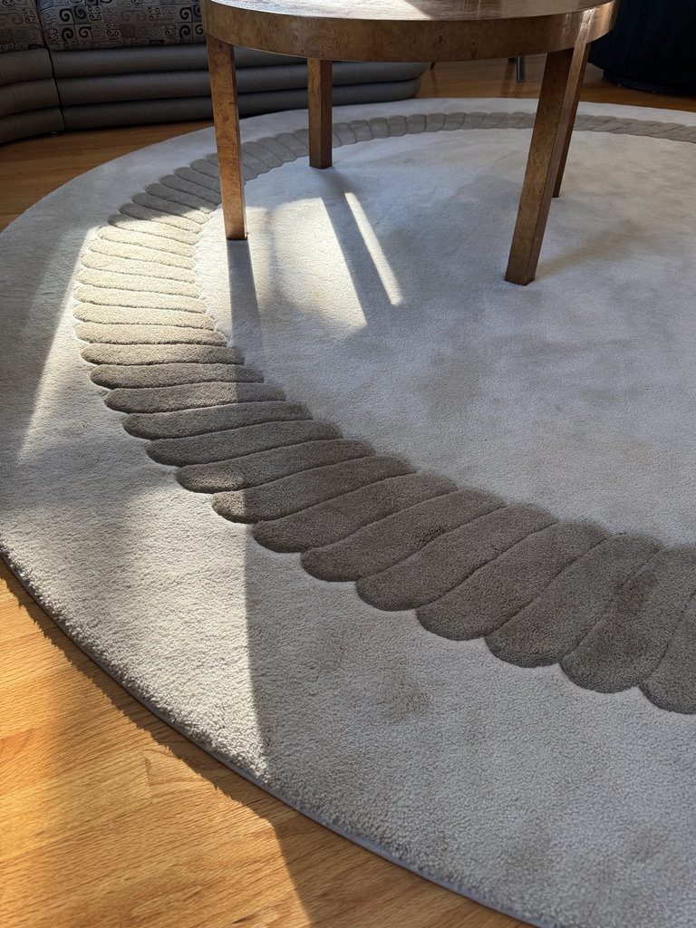 Round taupe rug with decorative border  - image 2 of 4