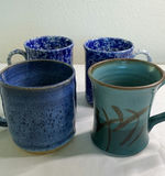 Blue ceramic teapot with mugs and kitchenware on a wooden tray - thumbnail 5 of 7