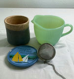 Blue ceramic teapot with mugs and kitchenware on a wooden tray - thumbnail 7 of 7