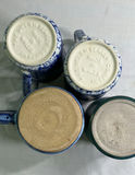 Blue ceramic teapot with mugs and kitchenware on a wooden tray - thumbnail 6 of 7