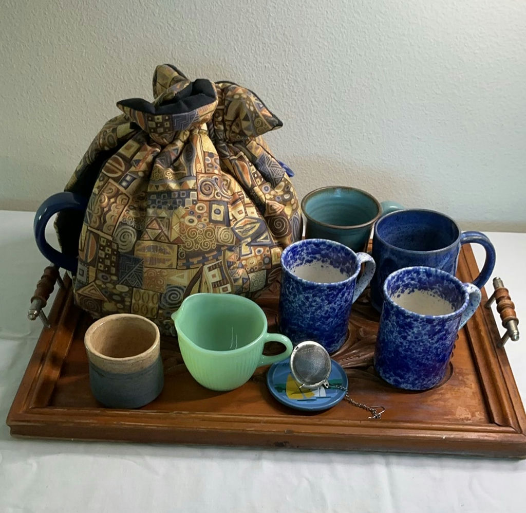 Blue ceramic teapot with mugs and kitchenware on a wooden tray - image 1 of 7