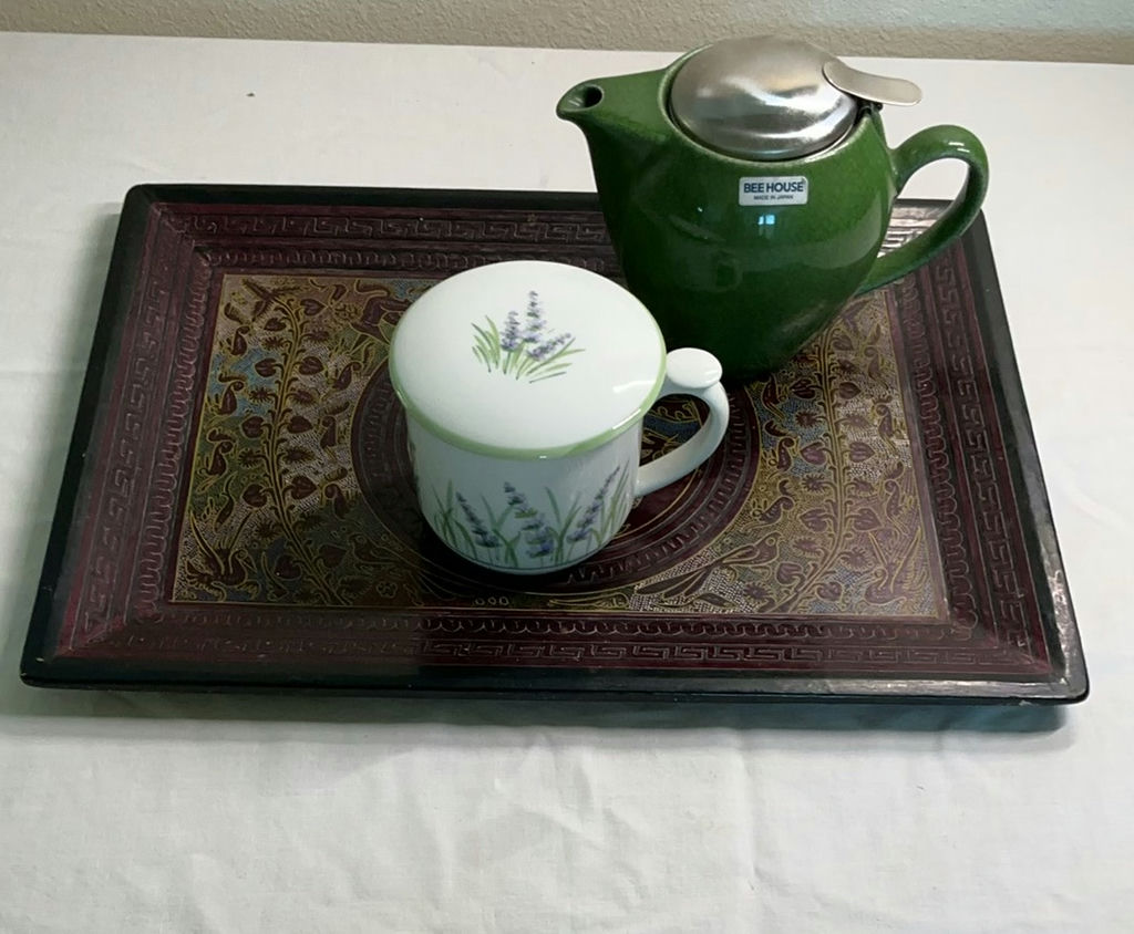 Green teapot with infuser, lavender-patterned cup and lid, on ornate decorative tray - image 1 of 5