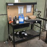 Industrial Workbench with Pegboard and Automotive Fluids - thumbnail 1 of 4