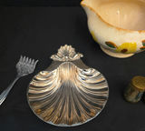 Floral ceramic creamer, shell-shaped metal dish, salt and pepper shakers, and ornate serving fork - thumbnail 3 of 6