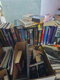 Assorted fiction books in stacks and boxes - thumbnail 5 of 10