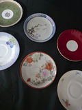 Assorted porcelain plates and saucers with floral and scenic designs - thumbnail 3 of 10