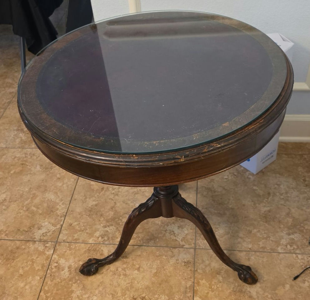Round glass-top pedestal table with carved wooden base and floral upholstered ottoman - image 3 of 6