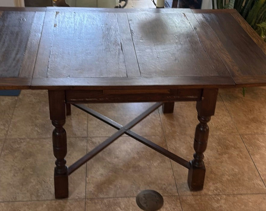 Dark wood dining table with panelled top and turned legs - image 1 of 8