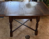 Dark wood dining table with panelled top and turned legs - thumbnail 1 of 8
