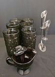 Six textured black glass tumblers with a matching black glass creamer and metal candleholders - thumbnail 1 of 5