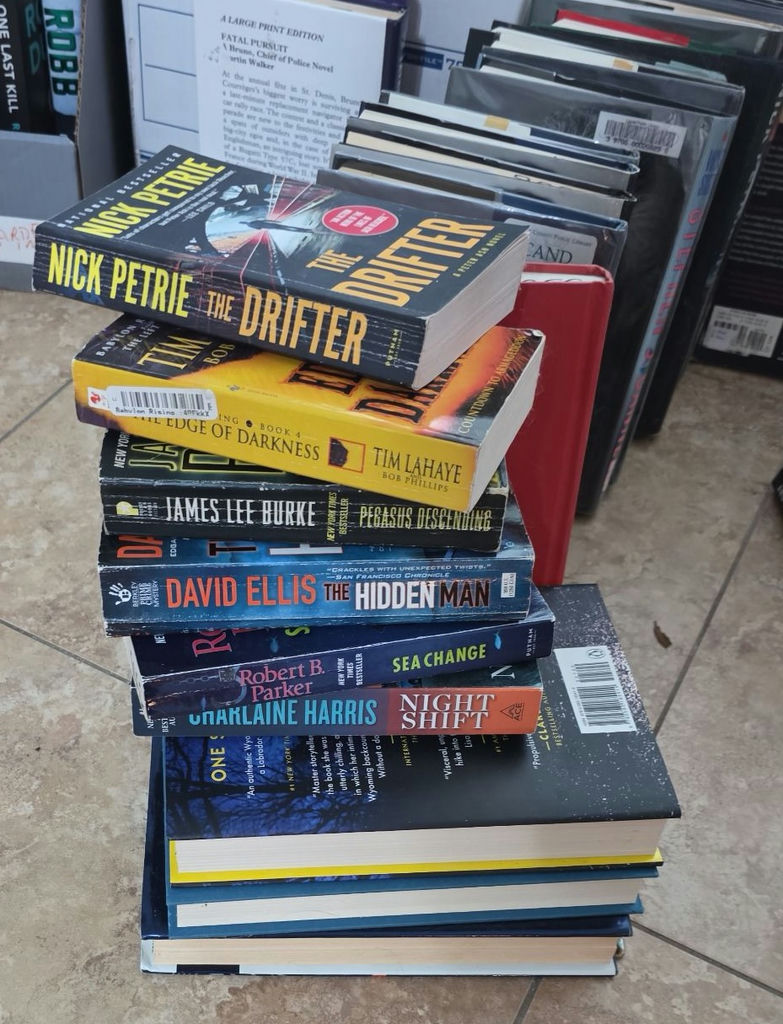 Assorted fiction books in stacks and boxes - image 2 of 10
