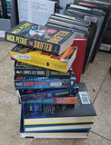 Assorted fiction books in stacks and boxes - thumbnail 2 of 10