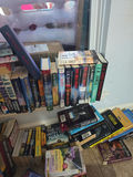 Assorted fiction books in stacks and boxes - thumbnail 8 of 10