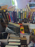 Assorted fiction books in stacks and boxes - thumbnail 6 of 10