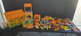 Colorful plastic toy houses and assorted figures - thumbnail 1 of 7