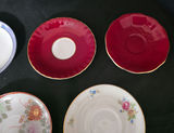 Assorted porcelain plates and saucers with floral and scenic designs - thumbnail 5 of 10