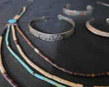 Silver engraved cuff bracelets with turquoise inlay and multi-strand beaded necklace - thumbnail 2 of 4