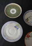 Assorted porcelain plates and saucers with floral and scenic designs - thumbnail 2 of 10