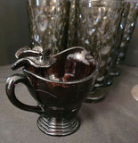 Six textured black glass tumblers with a matching black glass creamer and metal candleholders - thumbnail 4 of 5