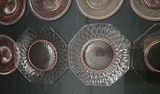 Assorted Glass Dinnerware: Round Copper-Patterned Plates and Clear Octagonal Plates - thumbnail 4 of 5