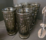Six textured black glass tumblers with a matching black glass creamer and metal candleholders - thumbnail 3 of 5