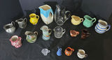 Collection of assorted ceramic pitchers, creamers, and small jugs - thumbnail 1 of 8