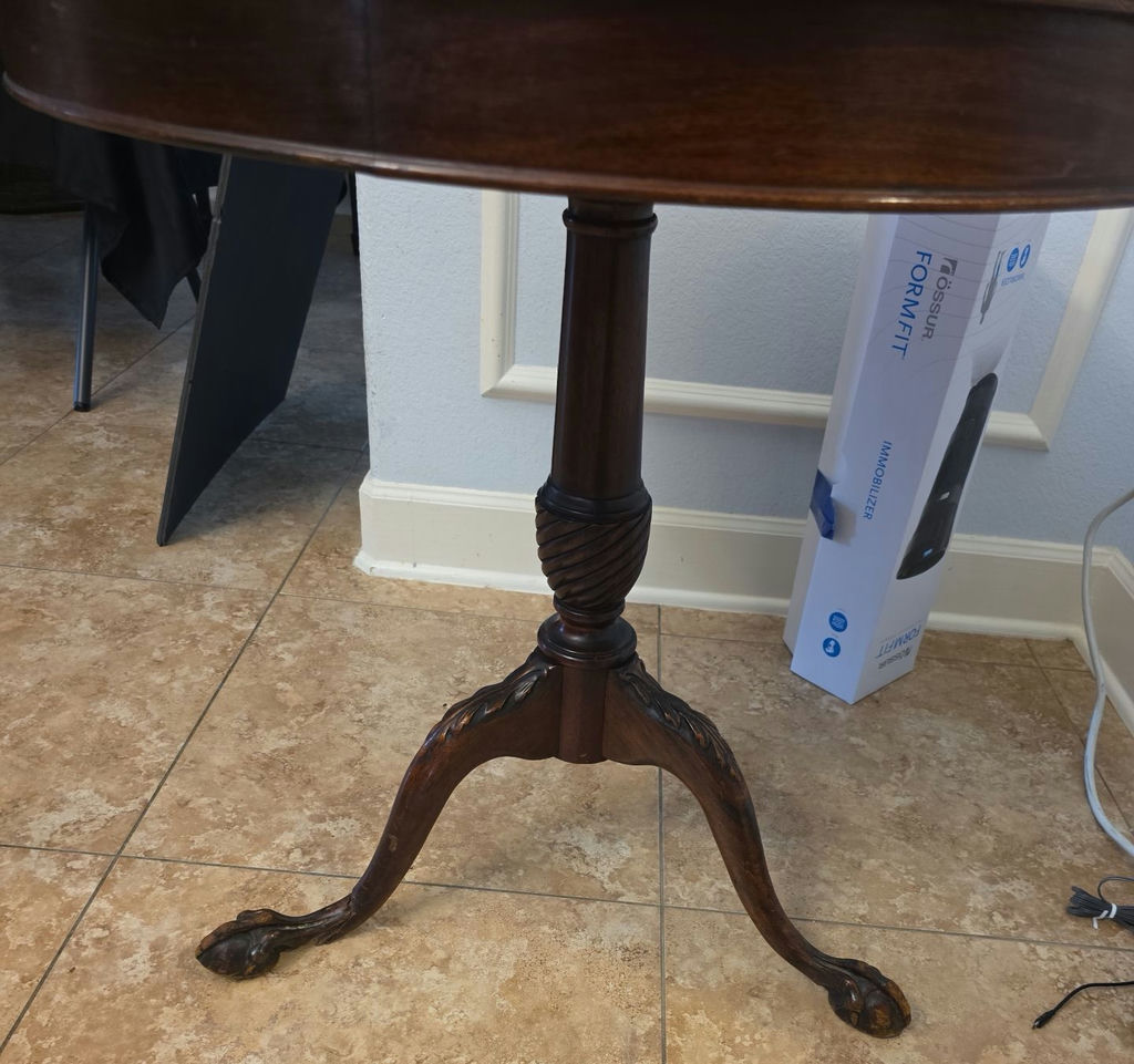 Round glass-top pedestal table with carved wooden base and floral upholstered ottoman - image 2 of 6