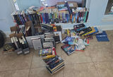 Assorted fiction books in stacks and boxes - thumbnail 1 of 10