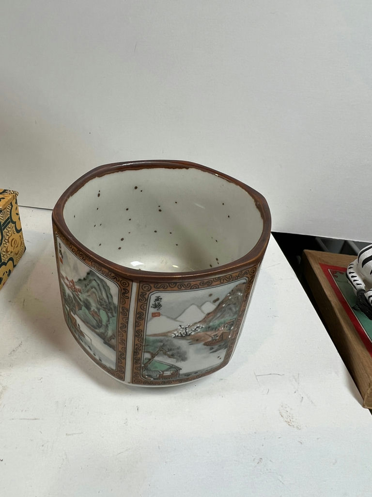 Blue-and-white porcelain head vase, decorative patterned box with jade figurine, cylindrical landscape ceramic vessel, and two seasonal plates - image 4 of 5