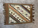 Woven geometric rug with animal motifs - 32" x 24" - thumbnail 1 of 4