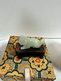 Blue-and-white porcelain head vase, decorative patterned box with jade figurine, cylindrical landscape ceramic vessel, and two seasonal plates - thumbnail 2 of 5