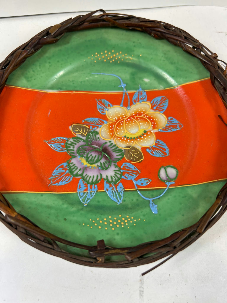 Pair of hand-painted porcelain plates with floral and bird designs in wicker frames - image 2 of 5