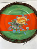 Pair of hand-painted porcelain plates with floral and bird designs in wicker frames - thumbnail 2 of 5