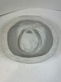 Circular ceramic bowl with carved interior face relief - thumbnail 2 of 3