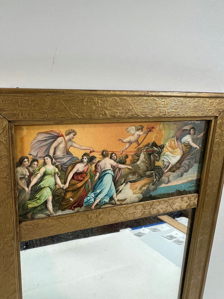 Gold framed wall mirror with classical painting panel and antique marbled-covered book - image 2 of 3