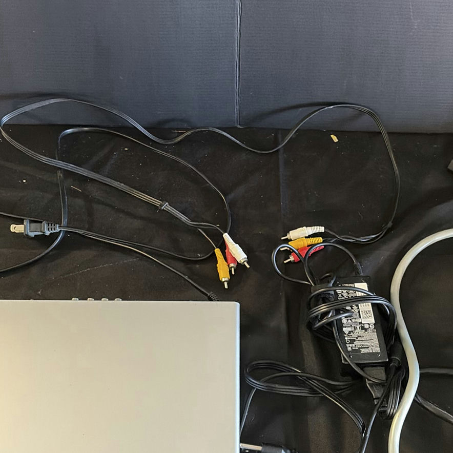 RCA DVD player, Shark handheld vacuum, and power strips with cords - image 2 of 5