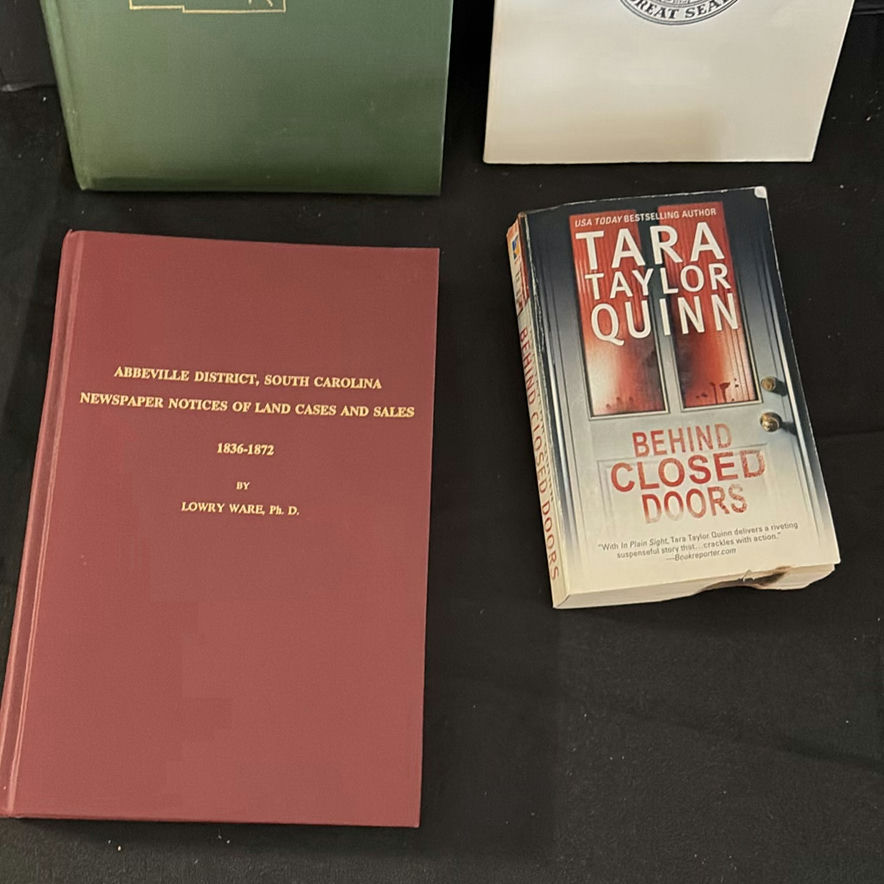 Assorted vintage books, a wooden mannequin, and a metal tote - image 2 of 5