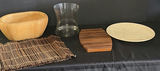 Wooden bowl, glass vase, bamboo placemat, slatted wooden trivet, and round beige disc - thumbnail 1 of 4
