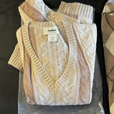 Beige argyle sweater, pink cable-knit sweater, cream cashmere cardigan, and gloves - thumbnail 2 of 5