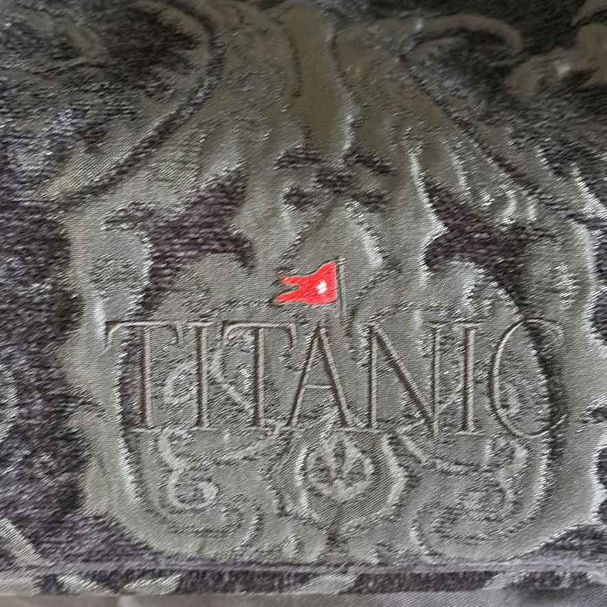Titanic-pattern textile, Atenti bag, Polo patch, Texas star decor, and vintage lighting - image 1 of 7