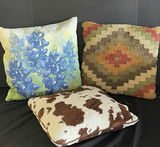 Decorative throw pillows: blue floral, kilim, and cowhide patterns - thumbnail 1 of 4