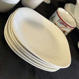 White ceramic dinnerware set with mugs, bowls, plates, and kitchen accessories - thumbnail 4 of 9