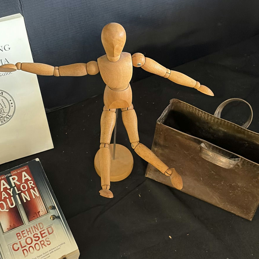Assorted vintage books, a wooden mannequin, and a metal tote - image 4 of 5
