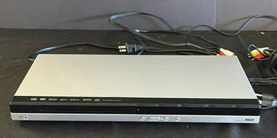 RCA DVD player, Shark handheld vacuum, and power strips with cords - Image 1 of 5